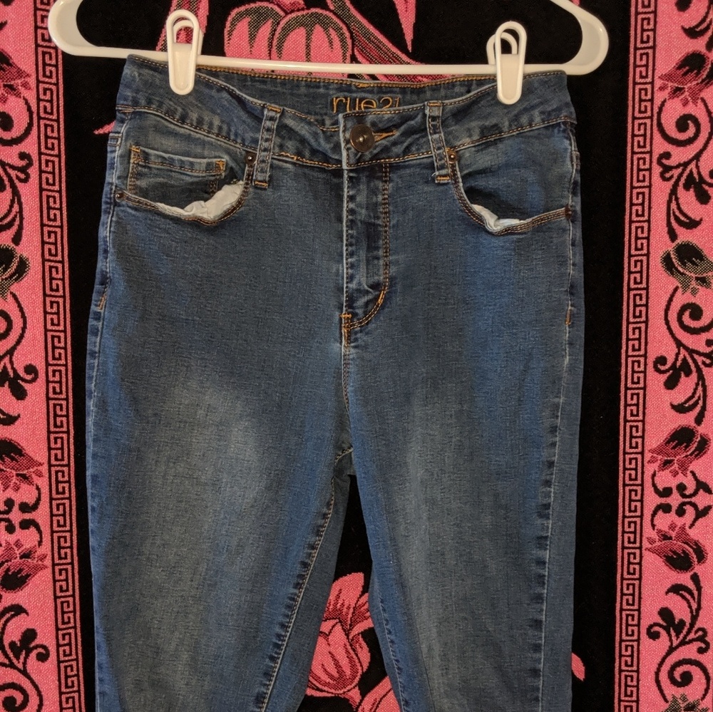 Dark ripped blue jeans